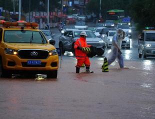 Rescuers search for survivors of China storms as super typhoon nears