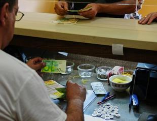 In Isareli-occupied West Bank, too much cash breaks economy