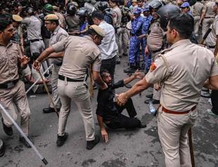 Indian police fire tear gas on exam protesters
