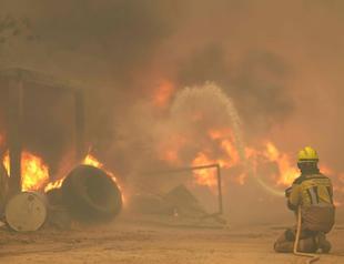 More than 160,000 flee out-of-control wildfires in France, Spain