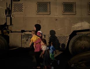 Israeli settlers injure Palestinians, set fire to West Bank homes