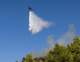 Greece battles new fire driven by winds