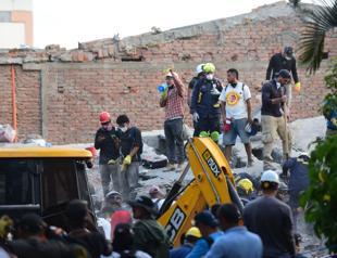 Woman pulled alive from Colombia quake rubble as toll rises