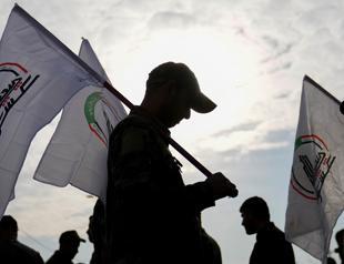 Iraq says arms of mobilization forces will not be collected