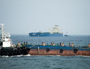 Iran, Oman plan for temporary Hormuz corridor as US impasse persists