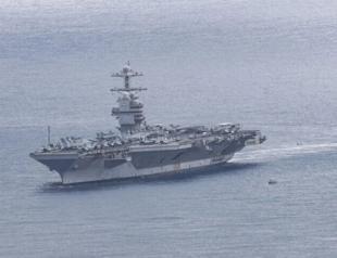Iran claims missile strikes on US carrier, destroyer