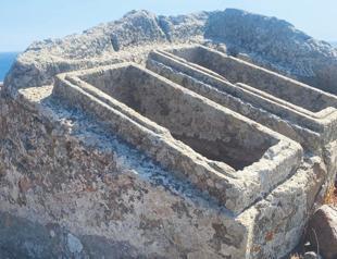 Twin sarcophagus carved into giant rock