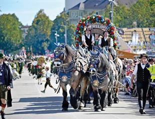 Munich’s Oktoberfest roars to life as the mayor taps first keg