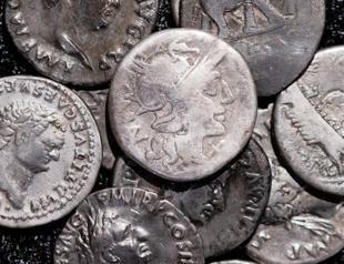 Amateur archaeologist finds Germany’s biggest hoard of Roman coins