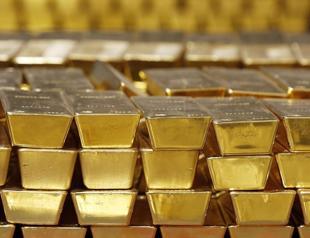Gold slips as dollar and bond yields weigh