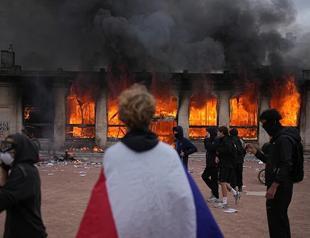 European stocks retreat as France violence spreads