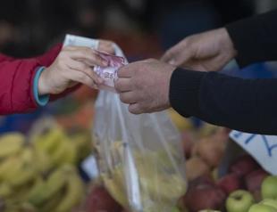 Households turn more optimistic on inflation, survey shows