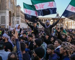 Syrians flood streets to celebrate end of Assad rule