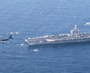 US deploys aircraft carrier as Iran warns against attack