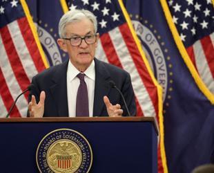 US Fed holds interest rates steady, defying Trump pressure
