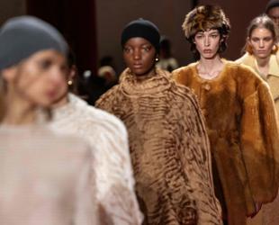 Milan runways highlight faux fur, backless designs, frayed fabrics