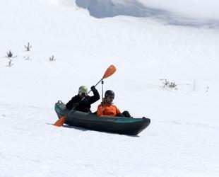 Kayakers glide over snow at Mount Erciyes in unusual winter experiment