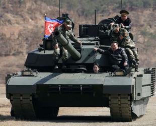 North Korean leader, daughter try out new tank