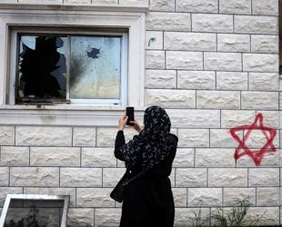 Israeli settlers burn buildings in attacks on West Bank villages