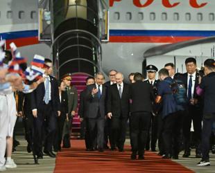 Putin lands in Beijing for talks with Xi