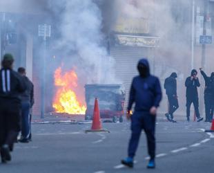 Protesters torch buildings and vehicles, block roads over Belfast stabbing