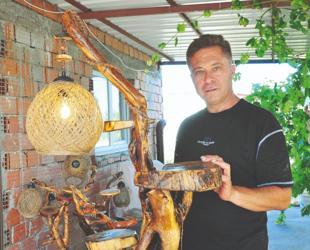Aigai guard transforms discarded wood into art
