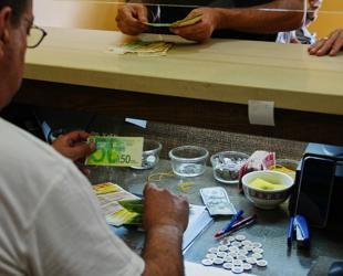 In Isareli-occupied West Bank, too much cash breaks economy
