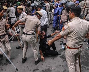 Indian police fire tear gas on exam protesters