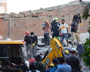 Woman pulled alive from Colombia quake rubble as toll rises