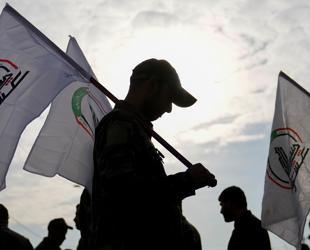 Iraq says arms of mobilization forces will not be collected