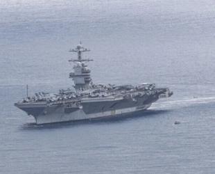 Iran claims missile strikes on US carrier, destroyer