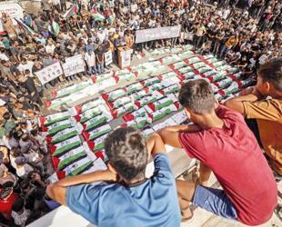 Gaza holds funeral for 100 Palestinians recovered from rubble of destroyed homes