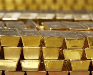 Gold slips as dollar and bond yields weigh