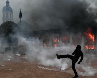 France counts cost of violent protests, 1,800 arrested