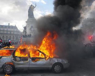 Protests banned in parts of Paris as Macron swipes at Trump
