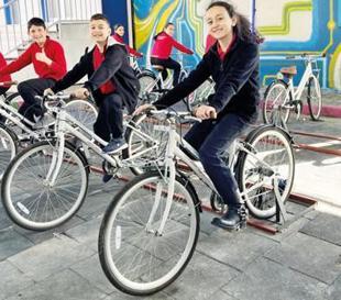 Students generate power by pedaling