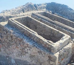 Twin sarcophagus carved into giant rock