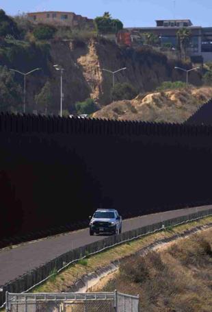 Biden to build more Mexico wall, says hands were tied