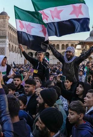 Syrians flood streets to celebrate end of Assad rule