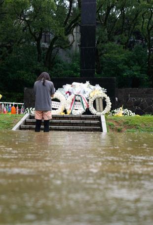 Japan urges evacuations after rains leave several missing