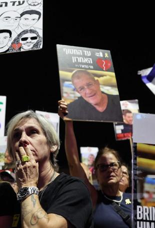 Israel says received remains of 3 Gaza hostages as fragile ceasefire holds