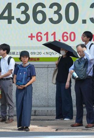 Asian stocks extend gains but US concerns hit dollar, boost gold