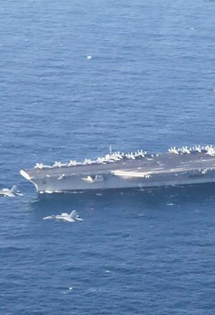 US deploys aircraft carrier as Iran warns against attack