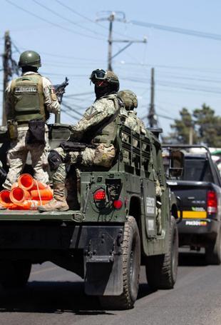 Mexico deploys 10,000 troops to end violence over drug lords death