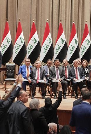Iraq PM vows monopoly on arms as parliament approves gov’t