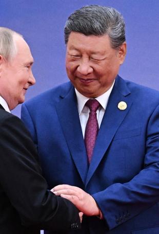 Xi hosts Putin in Beijing days after Trump