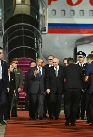 Putin lands in Beijing for talks with Xi