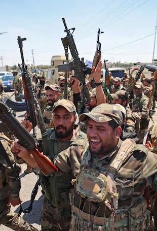 Iraq sets September deadline for integration of armed groups