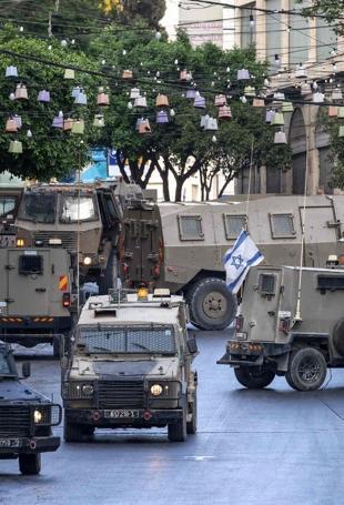 Palestinians say Israeli settlers torch 2 mosques in West Bank