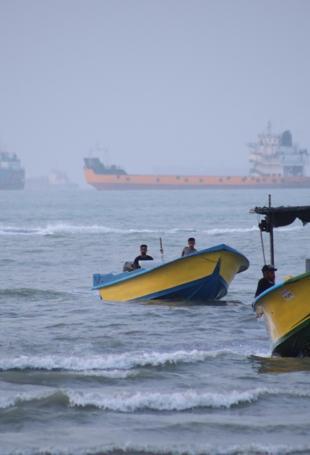 Iran says Hormuz route agreed with Oman, reopening uncertain